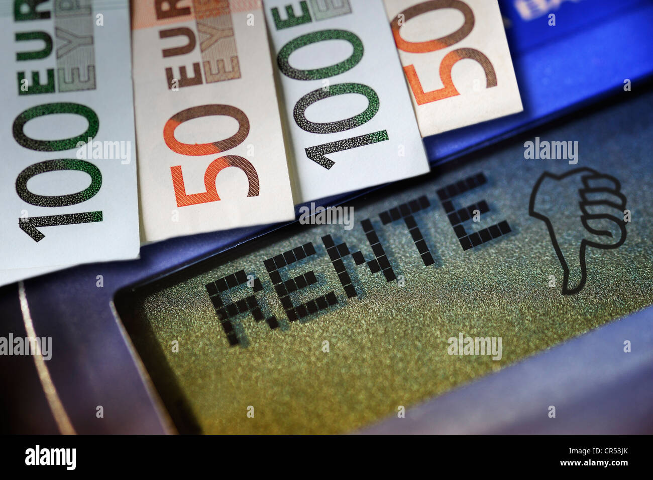 Lettering 'Rente', German for 'pension' on a calculator and banknotes, thumbs down icon, symbolic image for low pensions Stock Photo