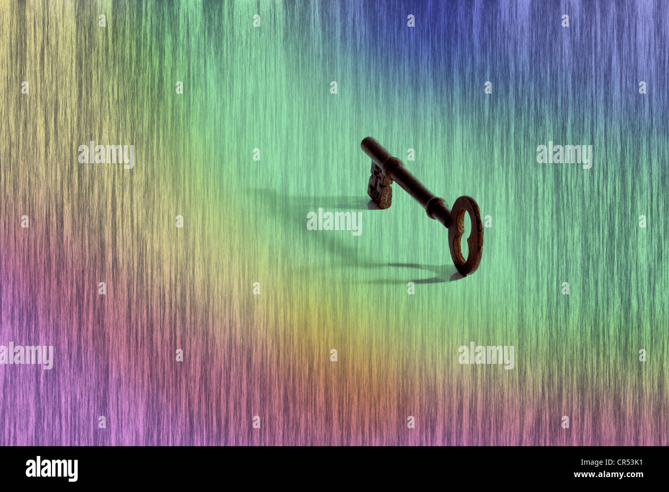 A concept image of an old rim lock key with shadow on a computer generated graduated patterned background Stock Photo