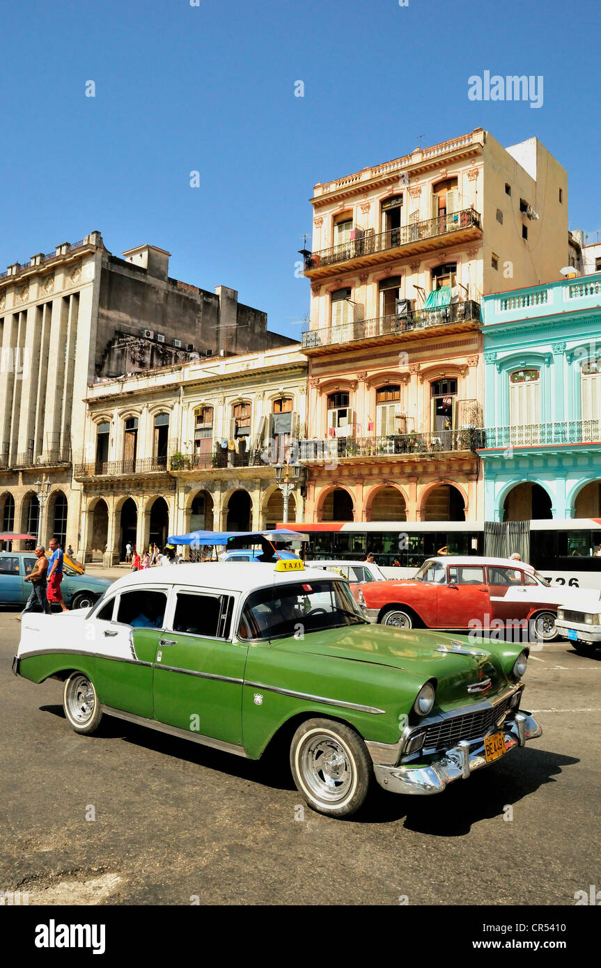 Vintage car in front of buildings with colourful facades, Habana Vieja, Old Havana, Havana, Cuba, Caribbean Stock Photo