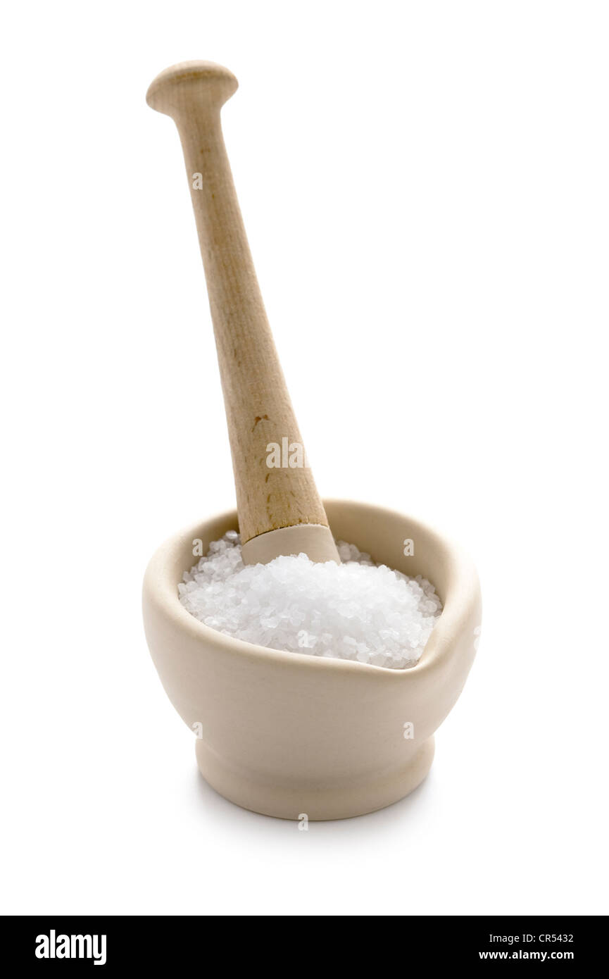 cooking salt crystals in a pestle and mortar Stock Photo