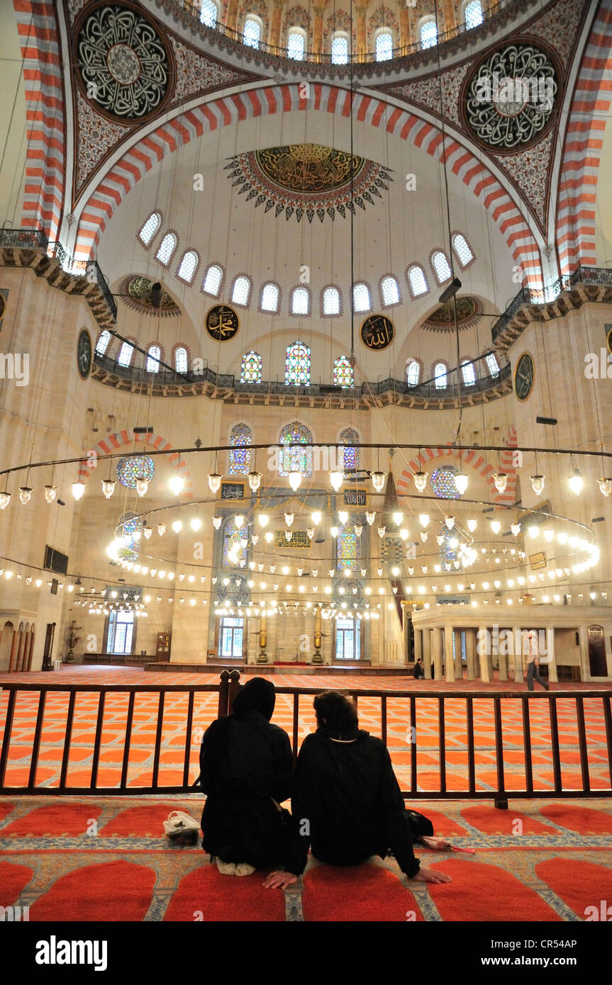 Worshippers in the Sultan Suleyman Mosque, Istanbul, Turkey, Europe Stock Photo