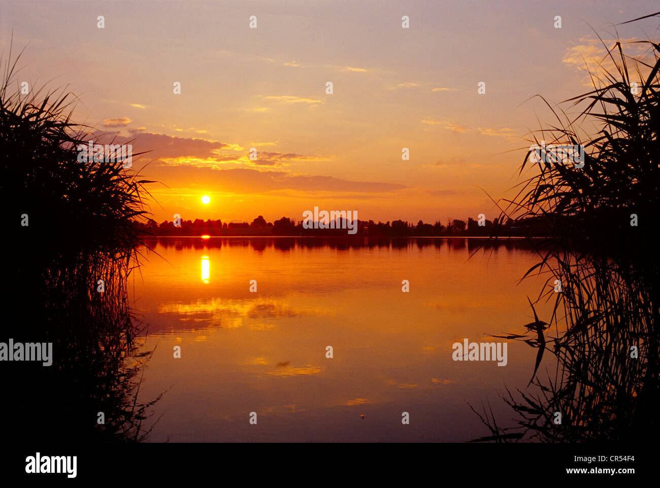 Sunset over the masurian lake Kolmowo in Poland. Sonnenuntergang über dem Kolmowo See in Masuren. Stock Photo