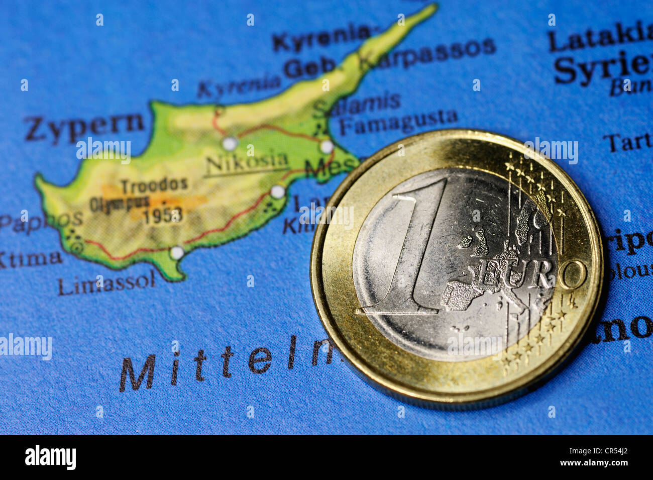 One euro coin on a map of Cyprus, symbolic image for the budget deficit