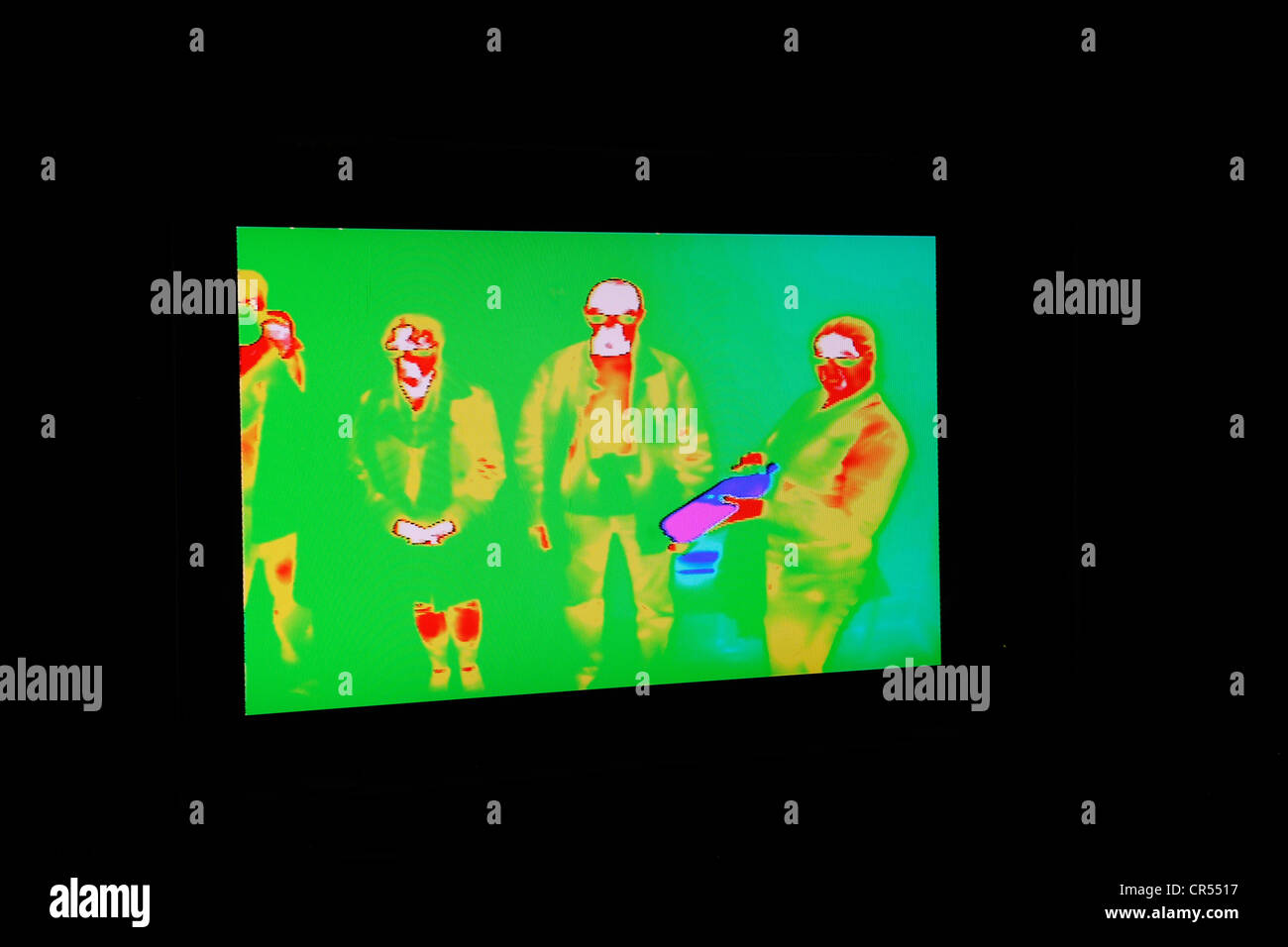 Thermographic image registers infrared heat signature.  Hotter areas appear red, cooler blue. Stock Photo