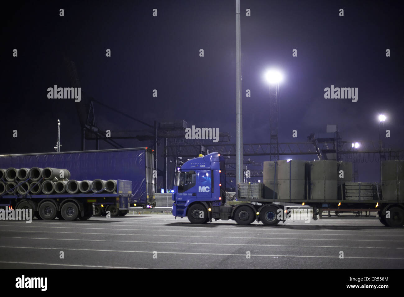 lorries waiting at stena line terminal at night in belfast harbour northern ireland uk Stock Photo