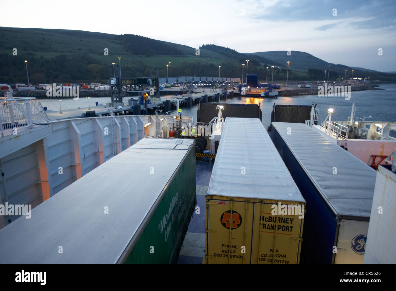 freight lorries on vehicle deck of a modern ferry arriving at cairnryan harbour at dawn northern ireland uk Stock Photo
