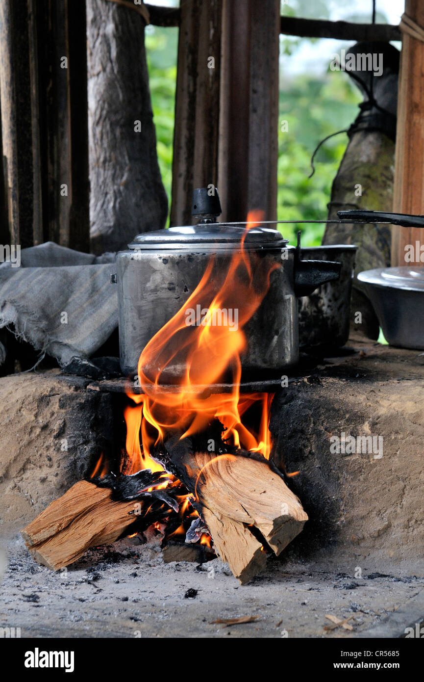 Pressure cooker on stove made of clay with a wood fire, Acampamento 12 de Otubro landless camp, Movimento dos Trabalhadores Stock Photo