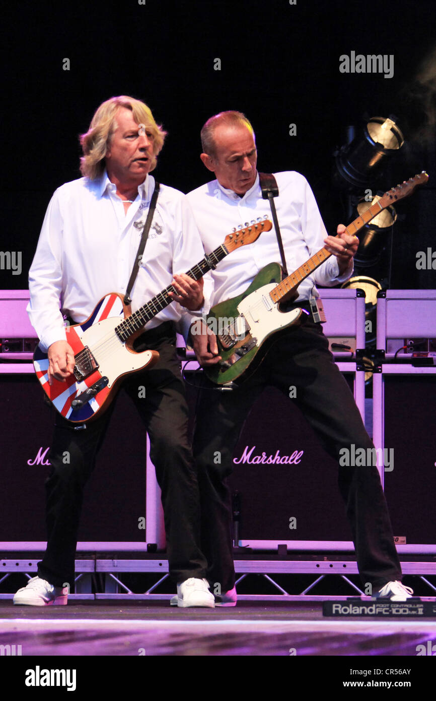Rick Parfitt, on the left, and Francis Rossi performing with their band Status Quo, Freilichtbuehne Junge Garde outdoor stage Stock Photo