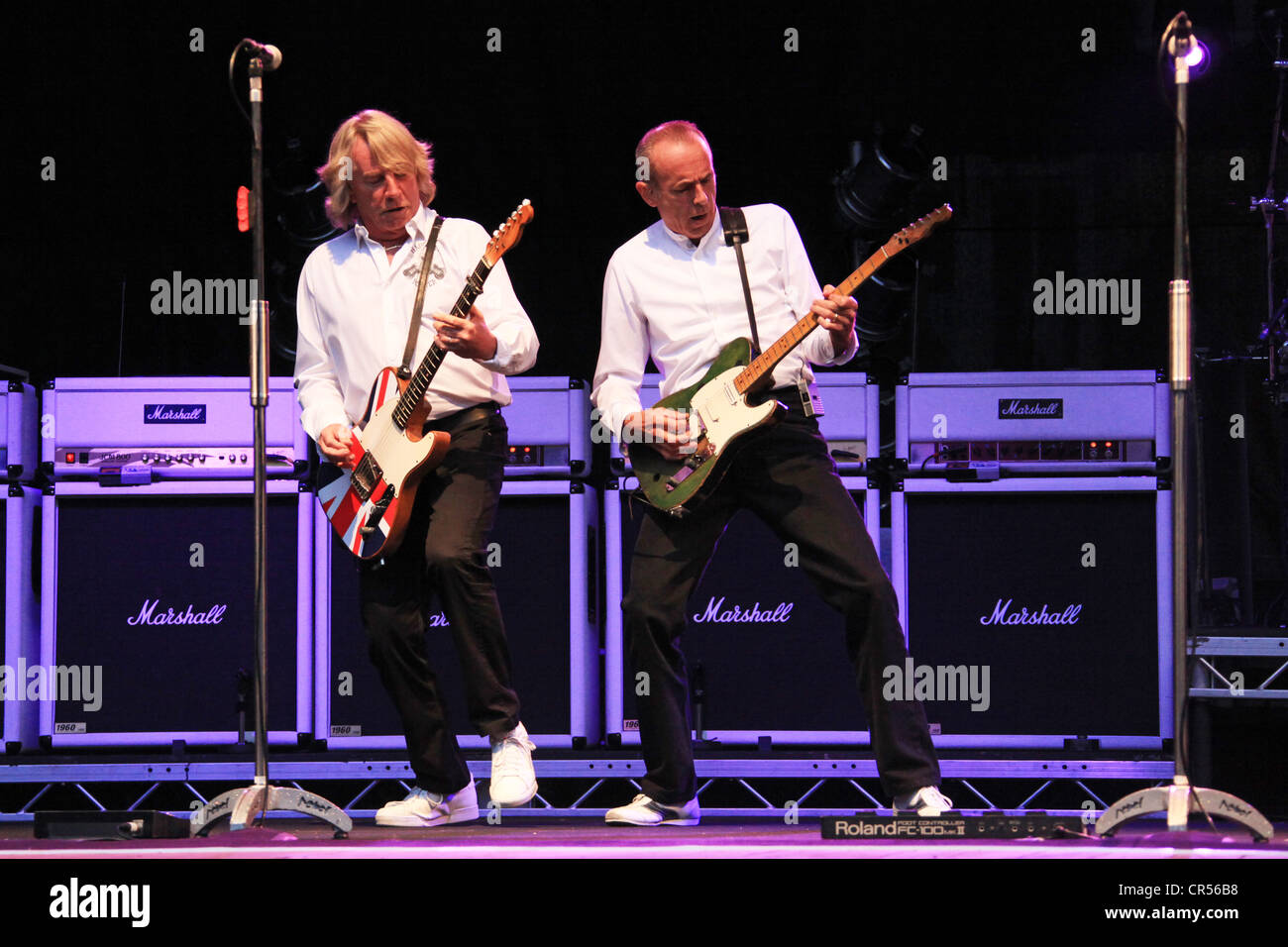 Rick Parfitt, on the left, and Francis Rossi performing with their band Status Quo, Freilichtbuehne Junge Garde outdoor stage Stock Photo