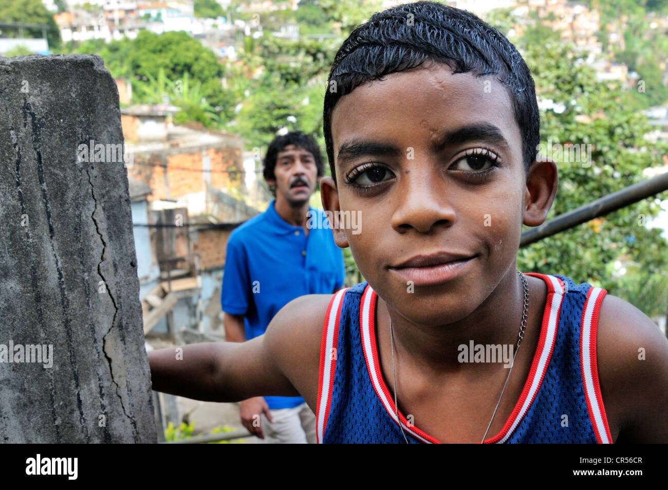 Dark-skinned boy and his father, slum district of Favela Morro da Formiga, Tijuca district, Rio de Janeiro, Brazil Stock Photo
