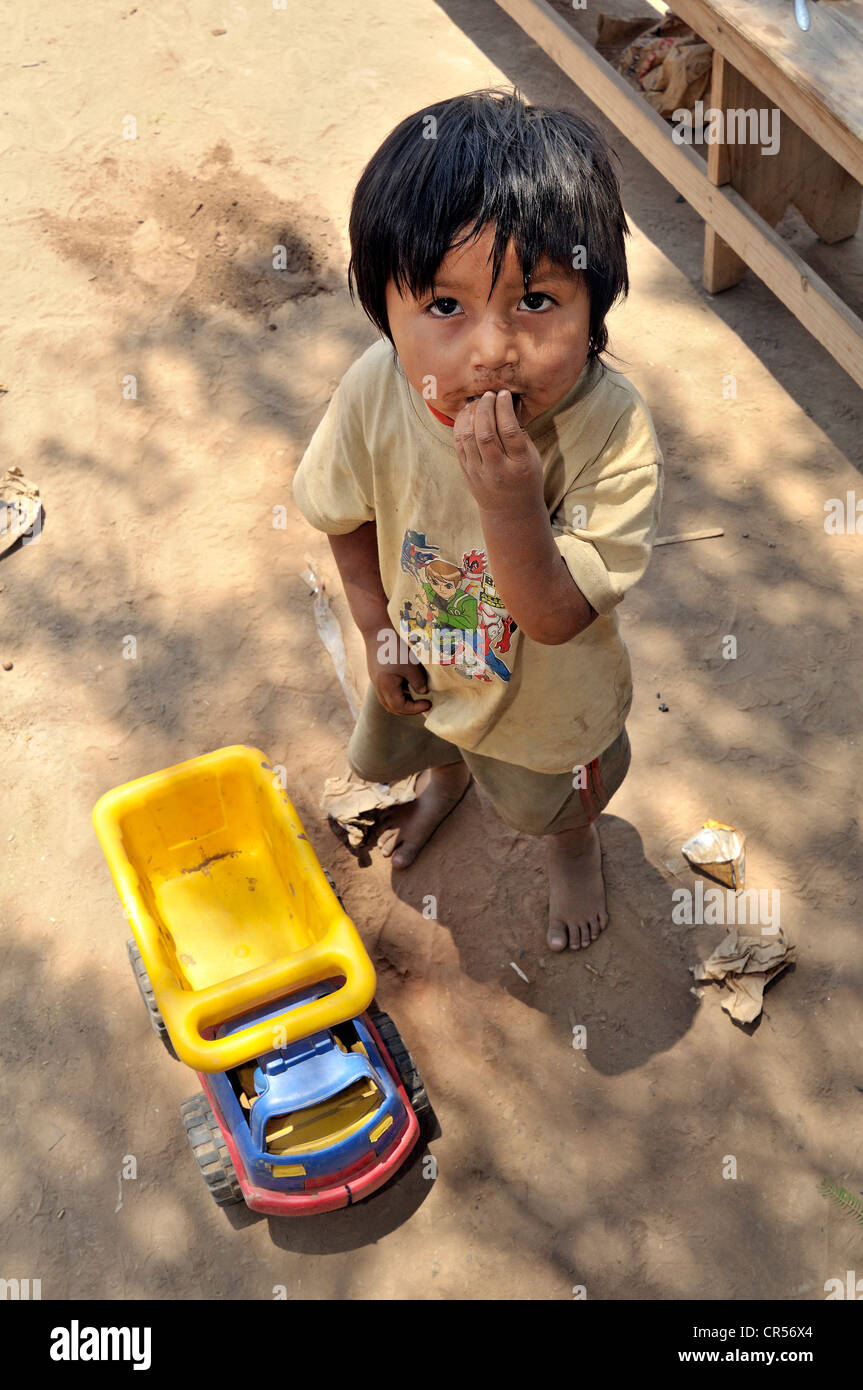 Indigenous boy with plastic toy truck indigenous community of