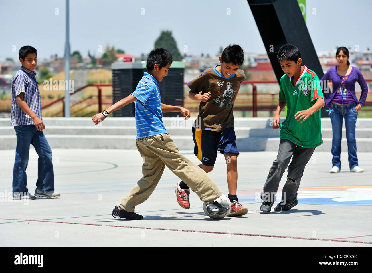 Young people playing football, Puebla, Mexico, North America, Latin America Stock Photo