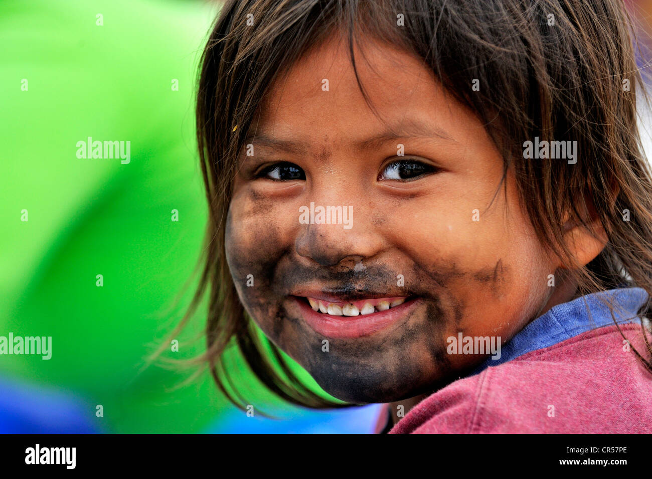 Portrait of a smiling boy with a coal-smeared face, poor district of Villa El Salvador, Lima, Peru, South America Stock Photo