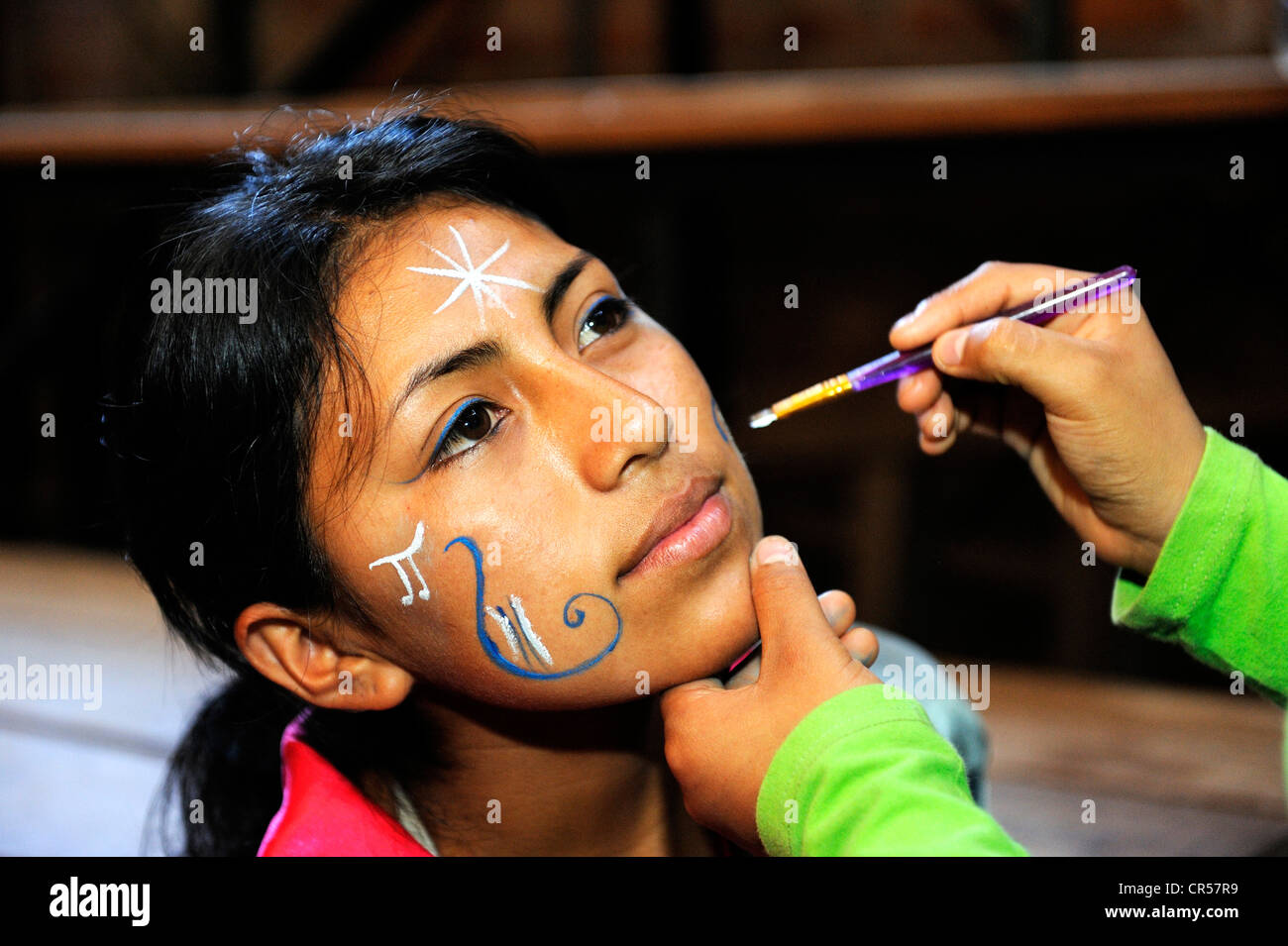 Teenage girl having make-up done, Arena y Esteras theatre group, Villa El Salvador district, Lima, Peru, South America Stock Photo