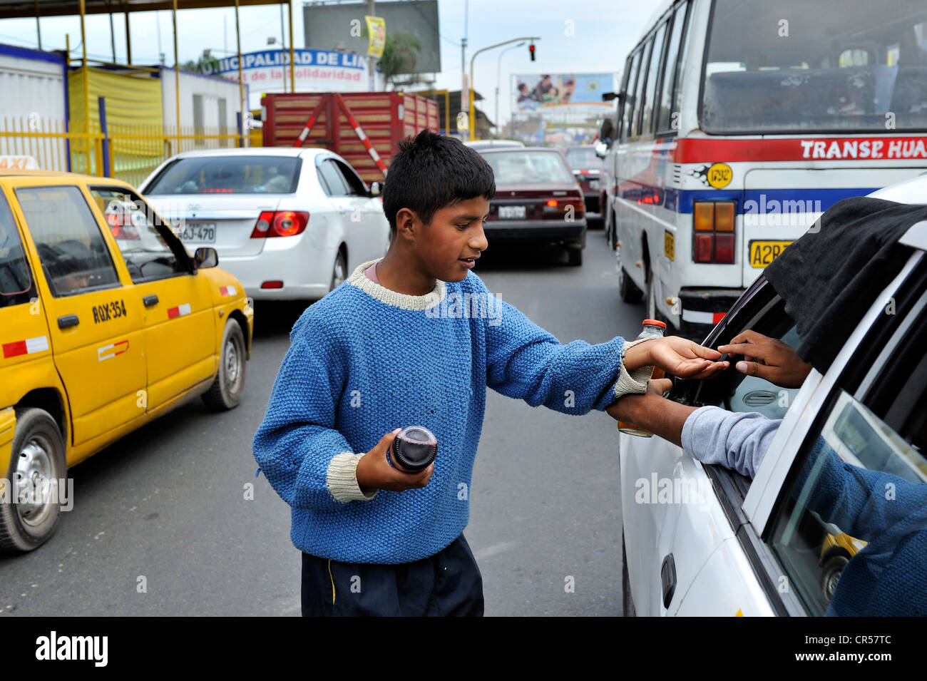 Child labour, boy, 11 years, selling soft drinks at an intersection, Lima, Peru, South America Stock Photo