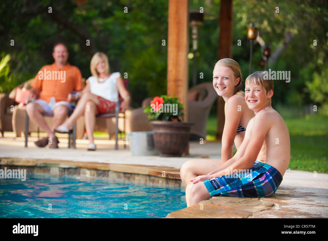 Family Fun At The Backyard Swimming Pool Stock Photo Alamy