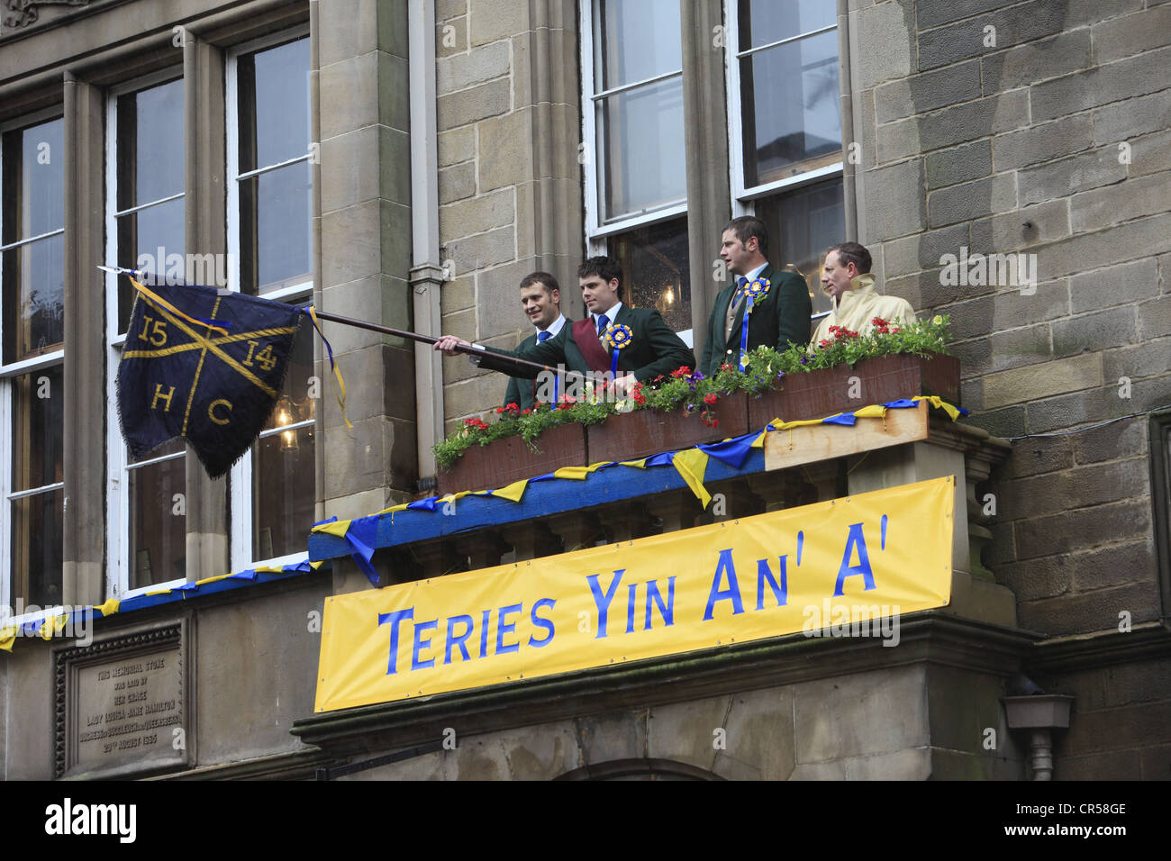 The Acting Father, Left & Right hand man waves the flag at the