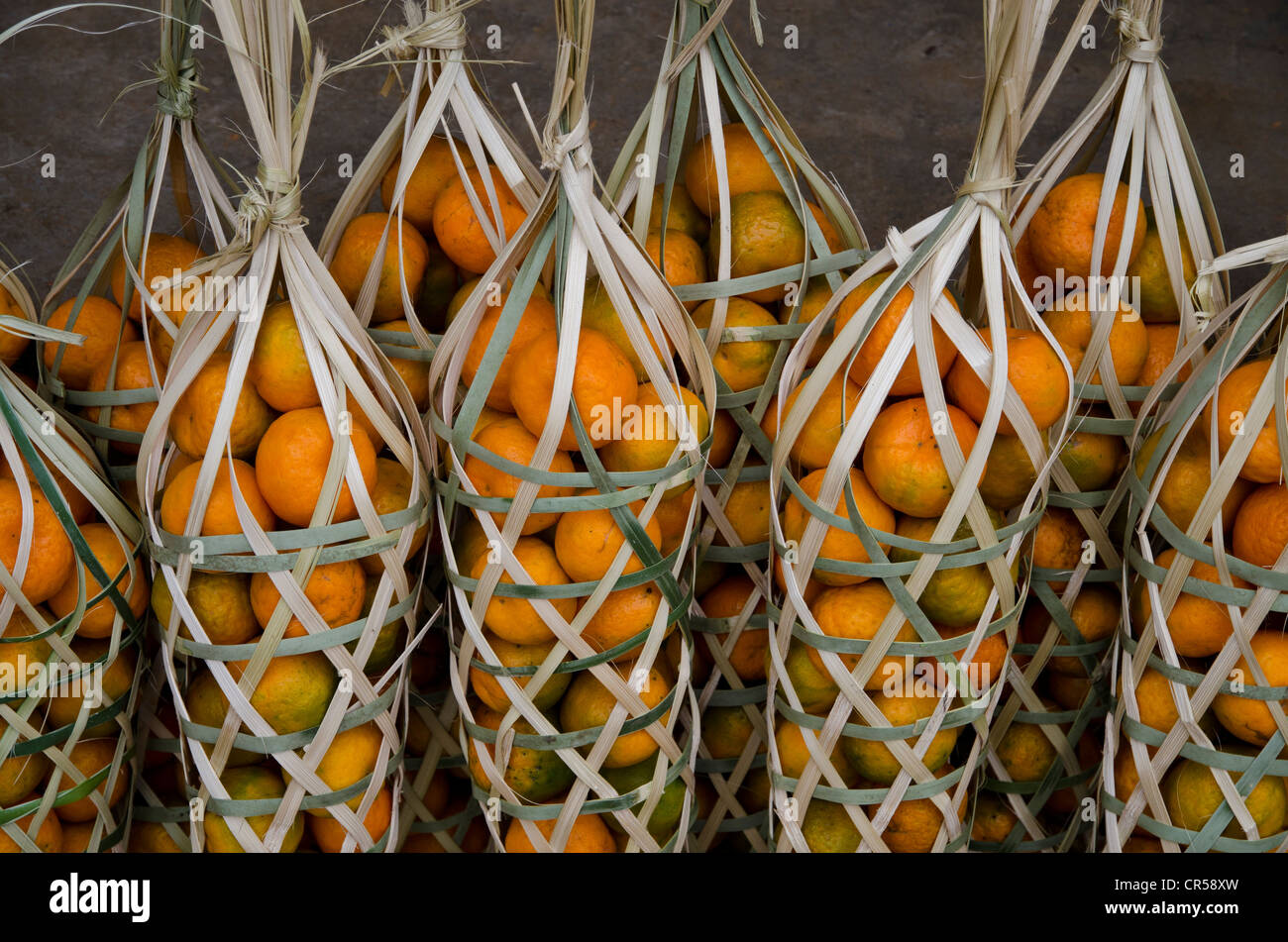 Oranges packed for sale on a roadside market near Ungma village, Nagaland, India, Asia Stock Photo