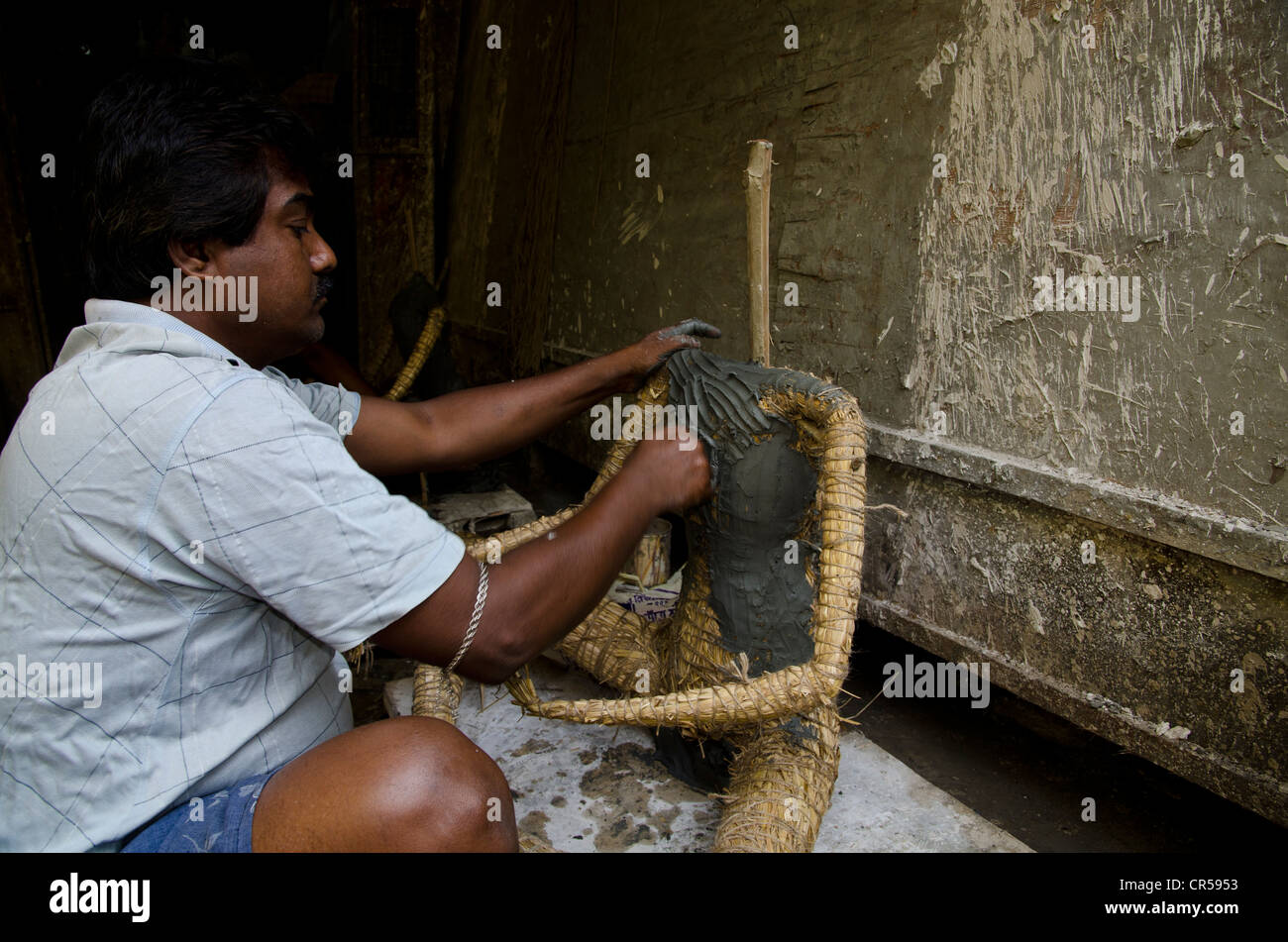 Artist making a statue for religious occasions, manufactory in Tollygunj, a suburb of Kolkata, West Bengal, India, Asia Stock Photo