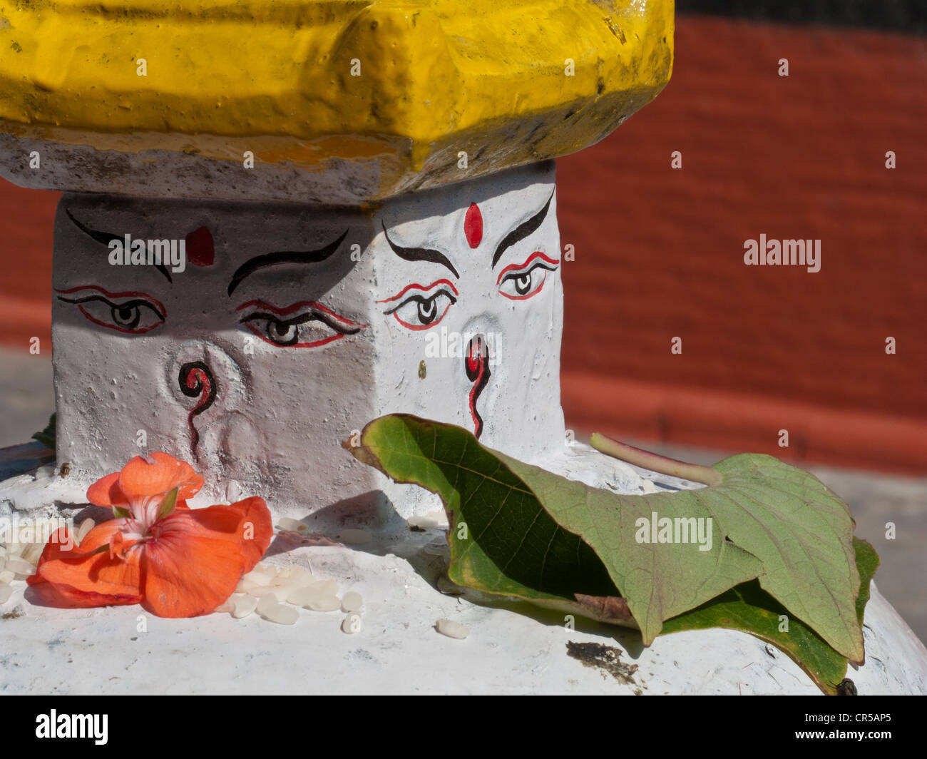 Buddha's eyes with little offerings, placed by local believers, Kathmandu, Nepal, South Asia Stock Photo