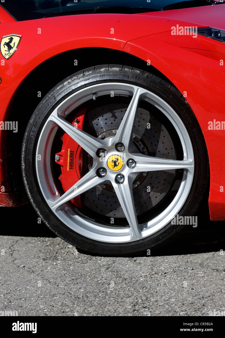 2011 Ferrari 458 Italia red Italian supercar in Modena - front alloy wheel and large red brake caliper Stock Photo