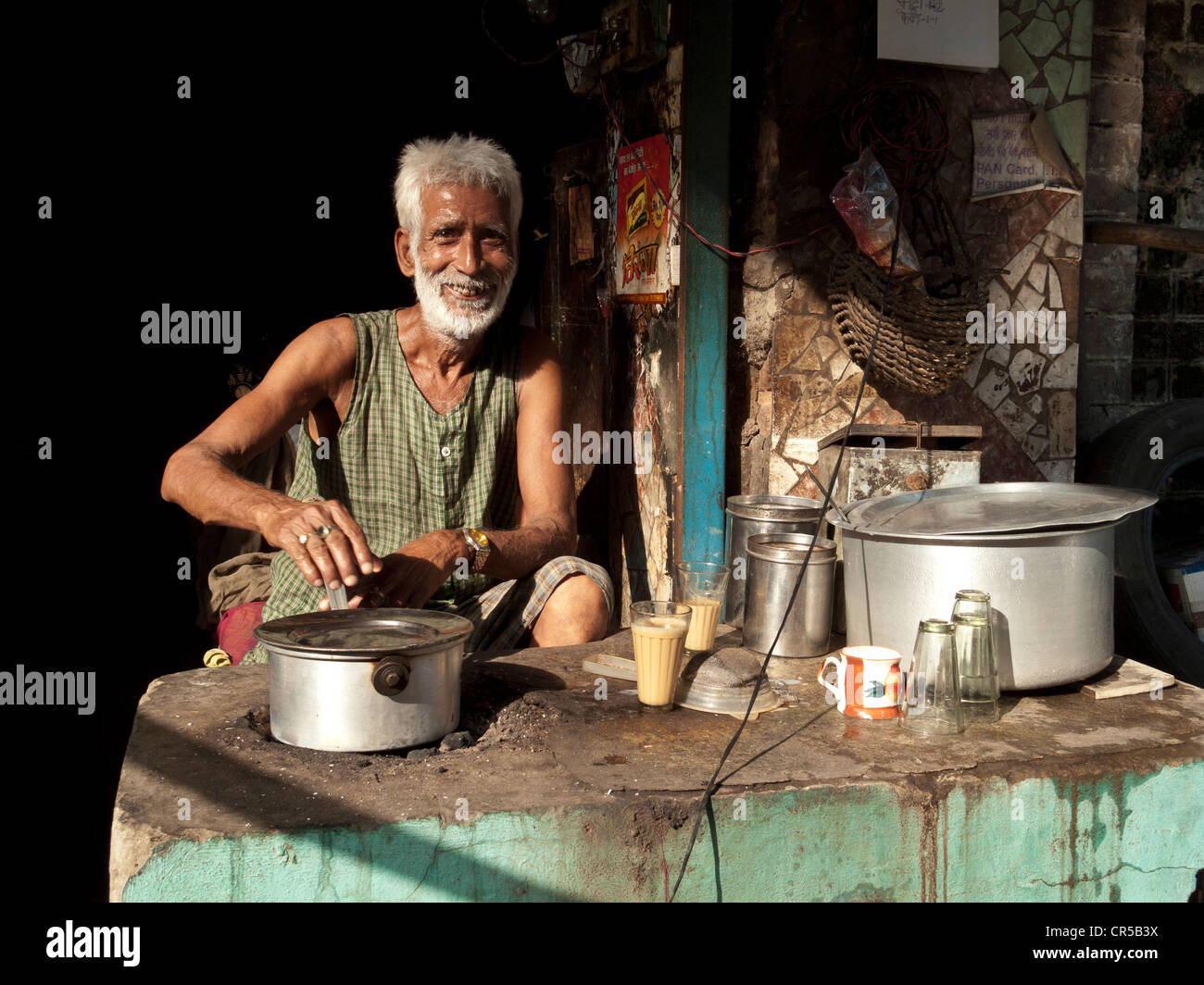 Chai wallah making tea in his chai shop in the streets of New Delhi, India, Asia Stock Photo