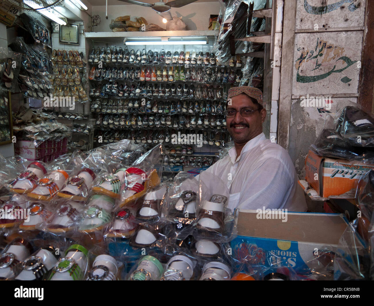 Local shoe-dealer in the streets of Lahore, Punjab, Pakistan, South Asia Stock Photo