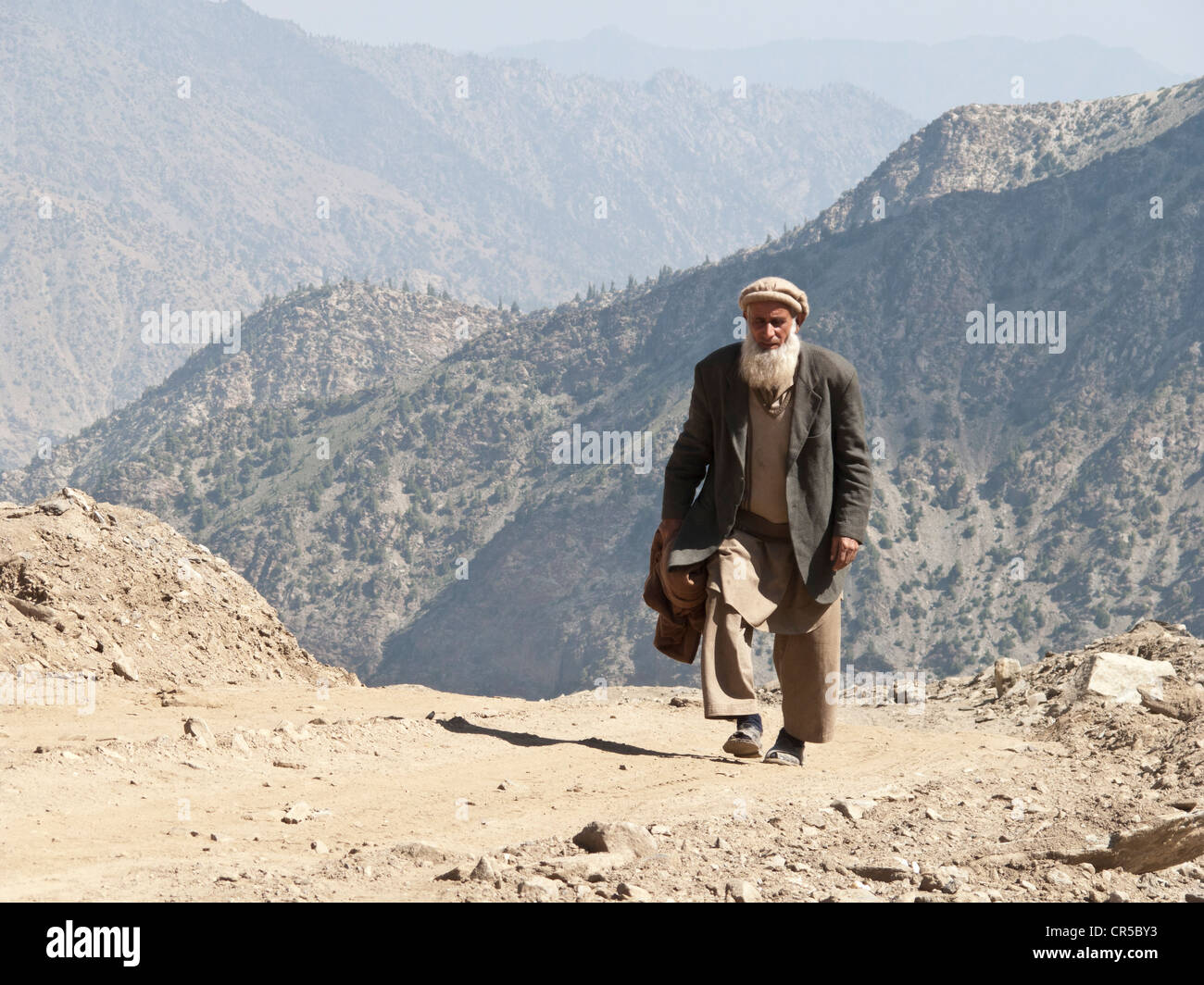 Local man on his way to cross Babusar Pass on foot, Chillas, North West Frontier, Pakistan, South Asia Stock Photo