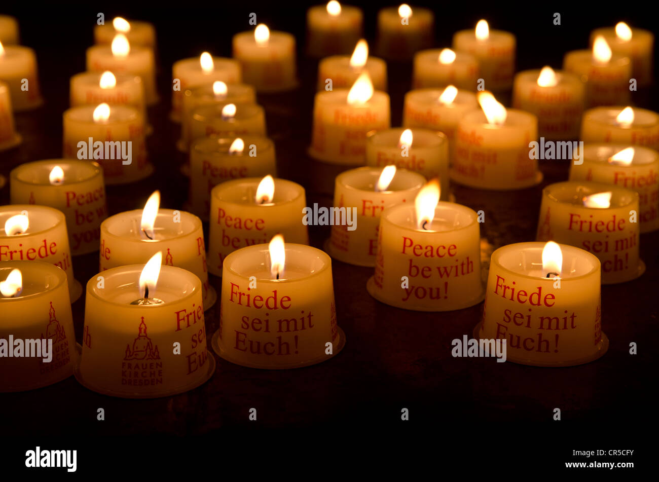 Candles as offerings for peace inside the Frauenkirche church, Dresden, Saxony, Germany, Europe Stock Photo