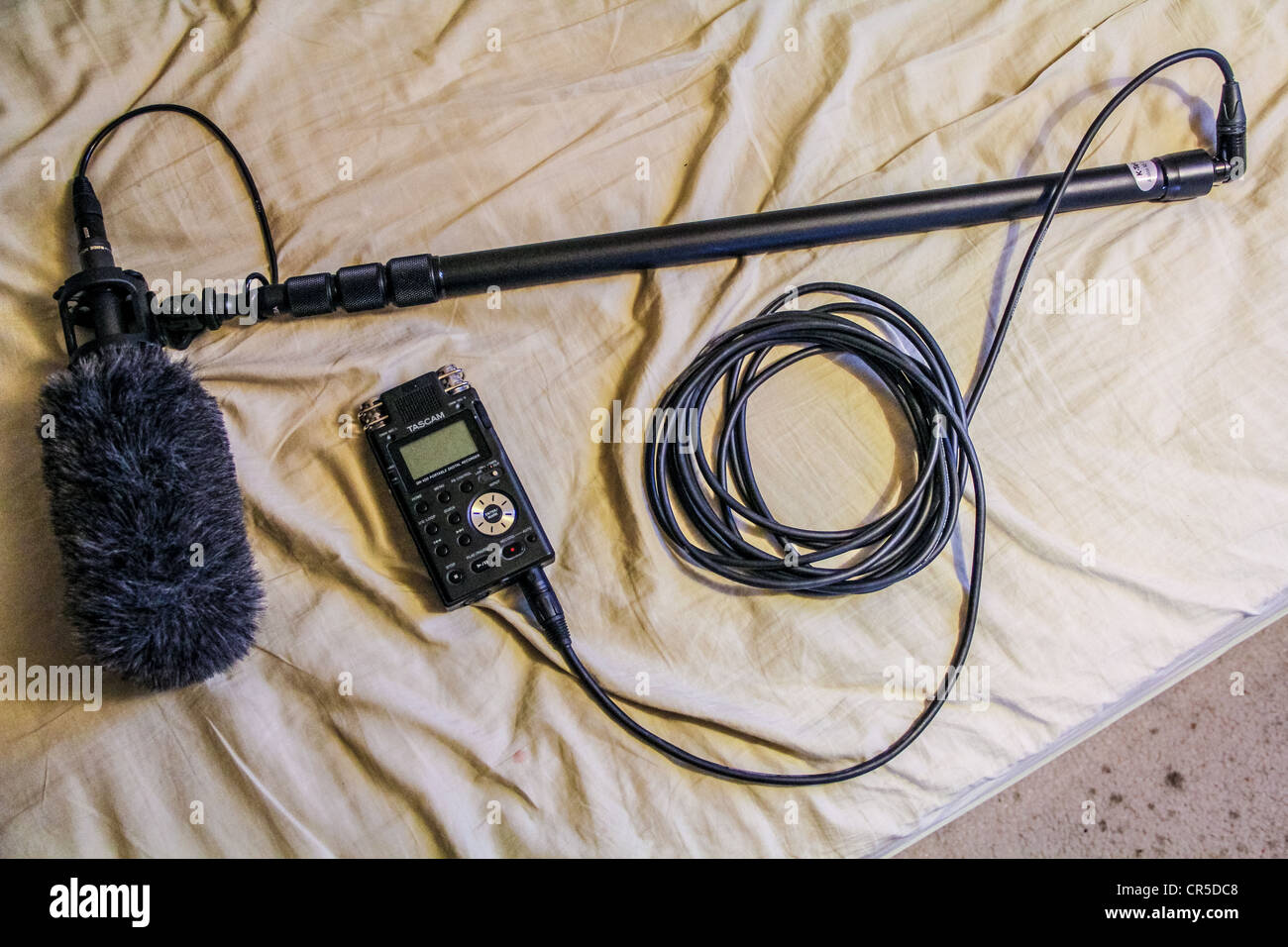 Audio recording equipment digital recorder boom and microphone with dead  cat noise suppressor Stock Photo - Alamy