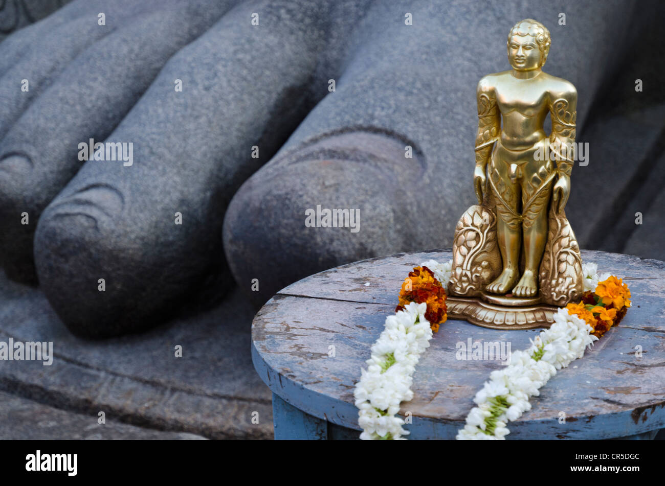 The small statue of Bahubali at the feet of the gigantic staue of Gomateshwara in Sravanabelagola, used for special rituals Stock Photo