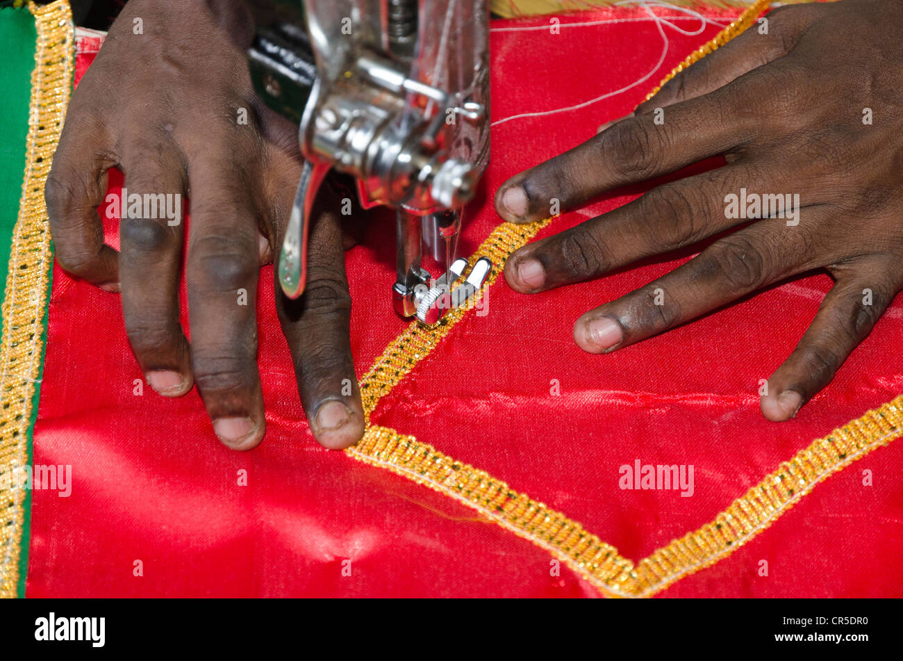 Tailor sewing with sewing machine, Madurai, Tamil Nadu, India, Asia Stock Photo
