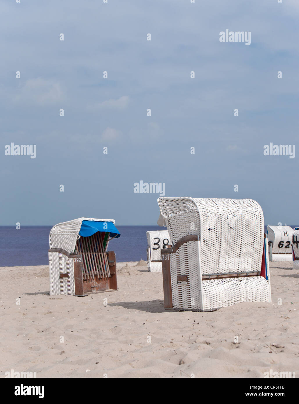 A 'Strandkorb' at the beach on a cloudy day Stock Photo