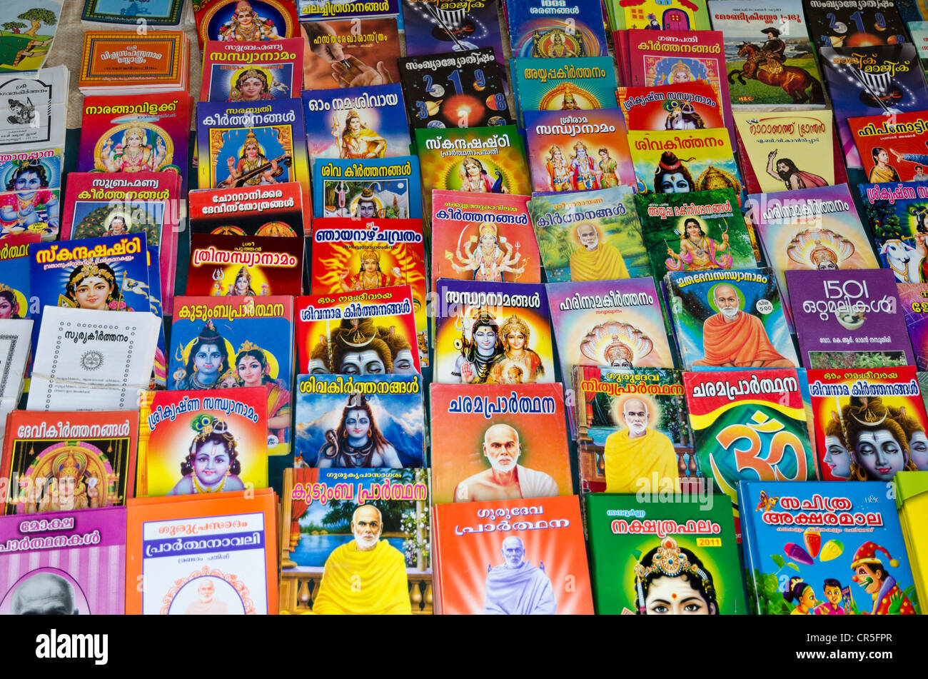 Books with the religious stories, for sale in Varkala, Kerala, India, Asia Stock Photo