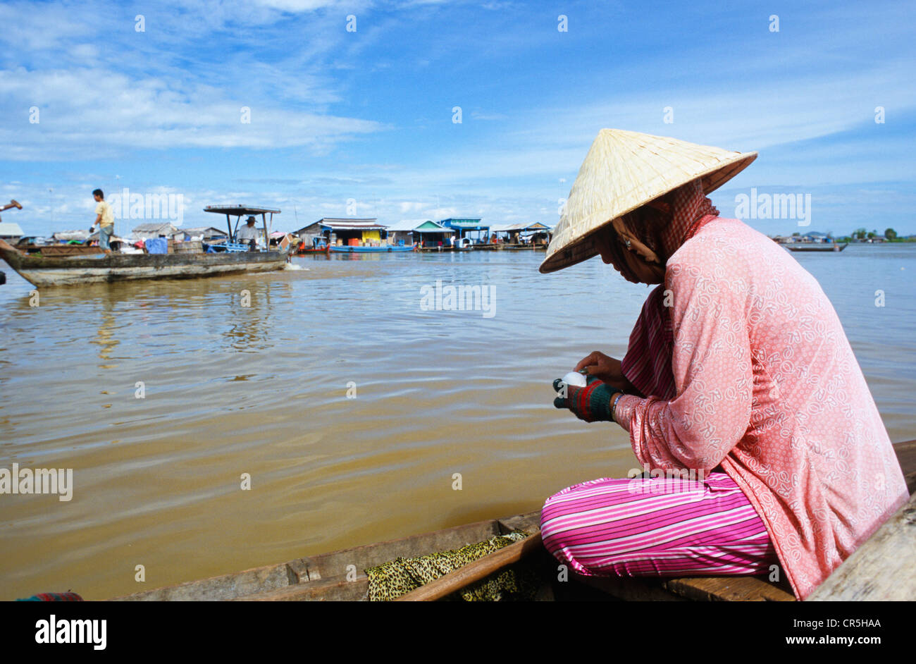 Vietnamese woman living in one of the floating villages along Tonle Sap River, Kampong Chhnang, Cambodia, Southeast Asia Stock Photo