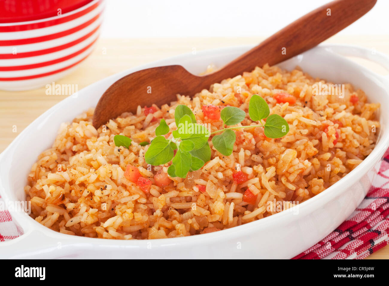 A serving bowl full of Spanish rice, a perfect accompaniment for chili. Stock Photo