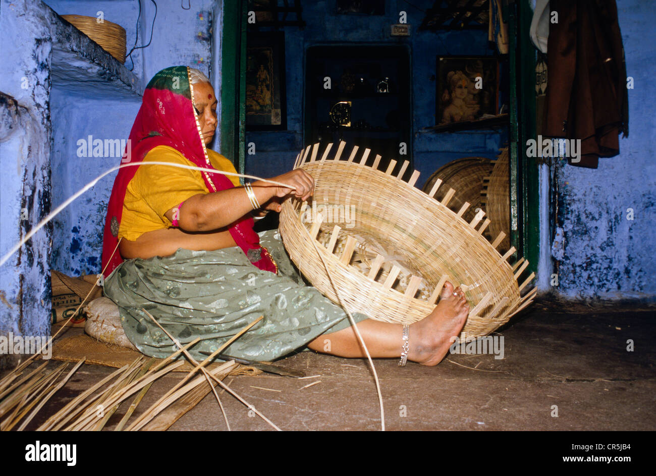 Local woman making basket from bamboo, Jodhpur, Rajasthan, India, Asia