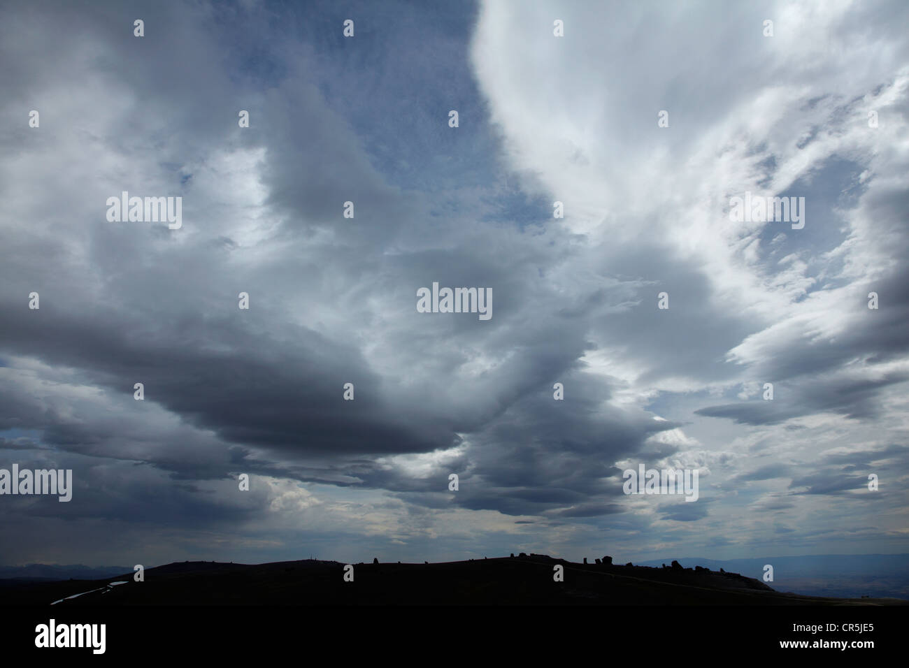Dark clouds over Kopuwai Conservation Area, Old Man Range, Central Otago, South Island, New Zealand Stock Photo