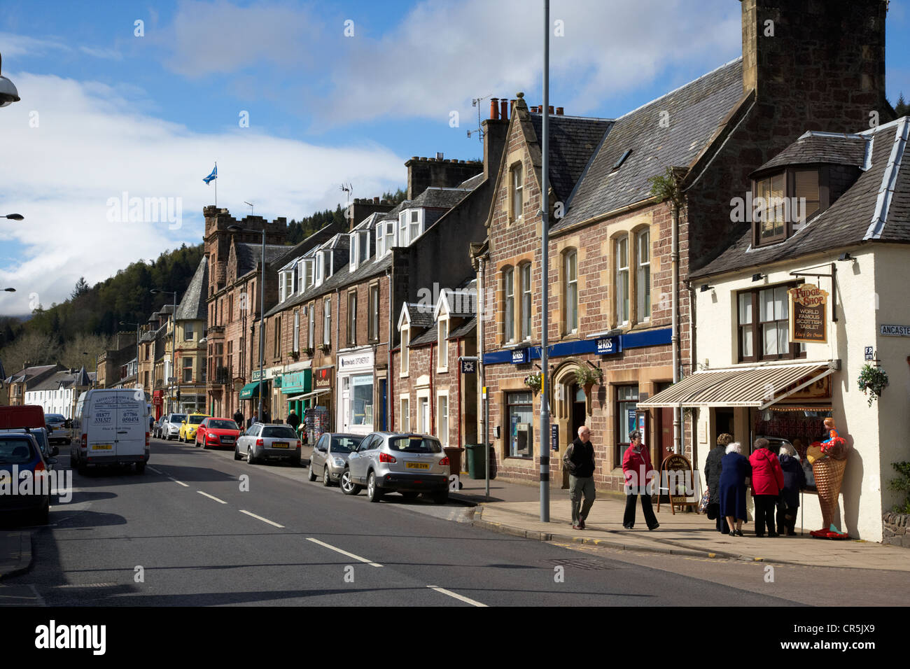 main road through the picturesque small town of Callander scotland uk Stock Photo