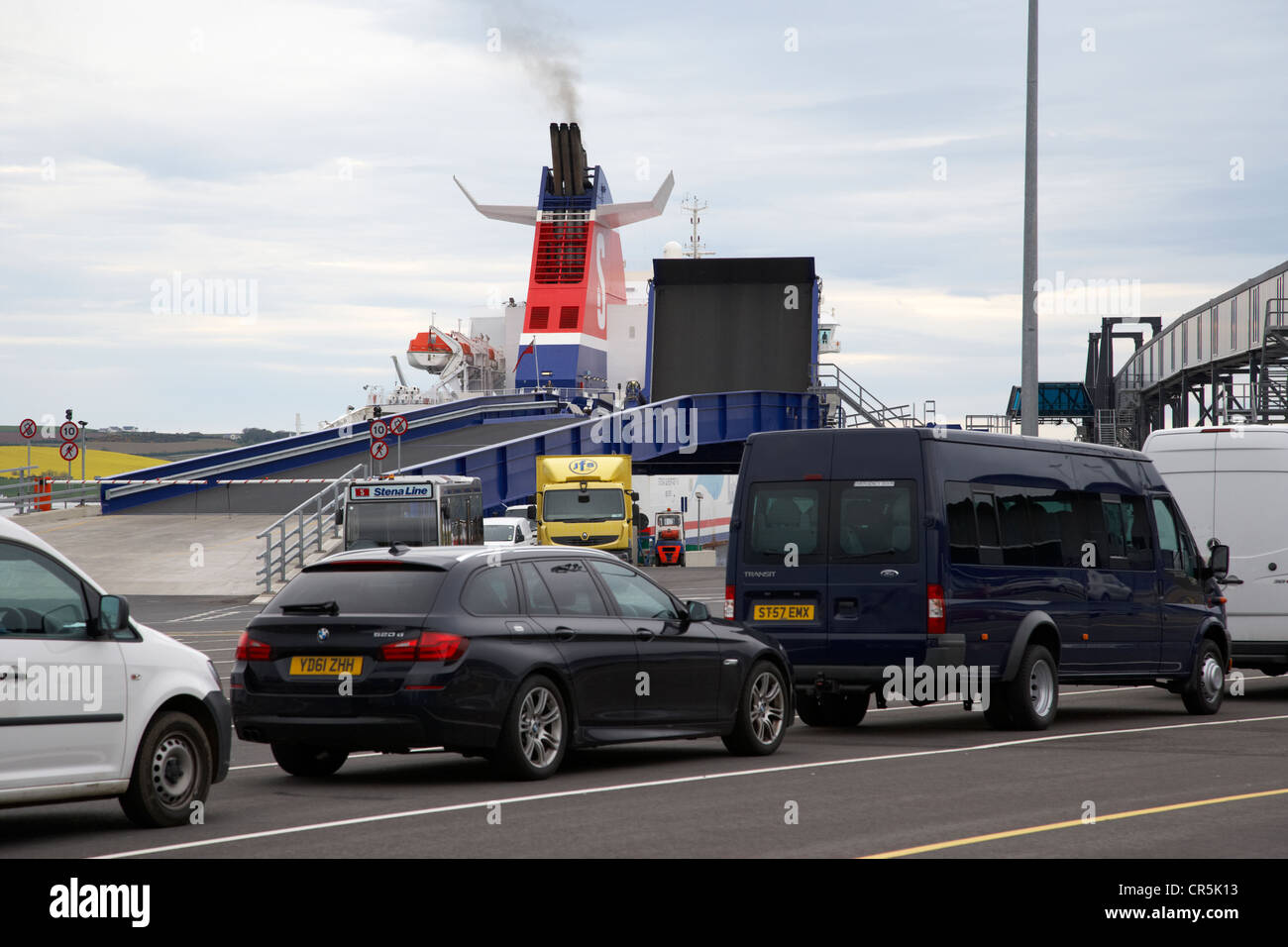 cars and vans wait in a queue to board the stena superfast ferry to