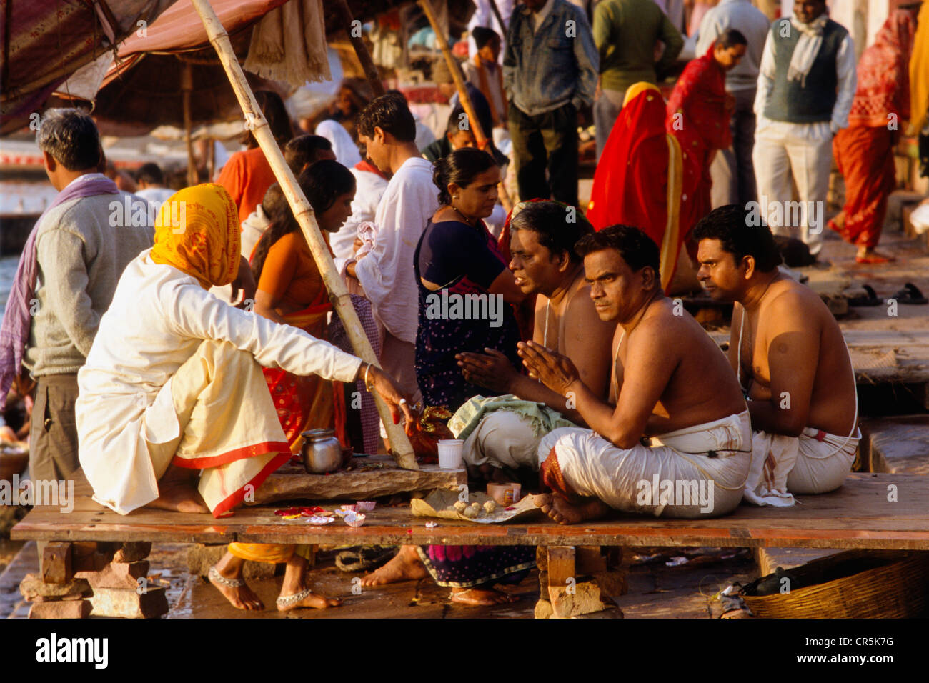 Priest offering ceremonies and blessings to pilgrims, Varanasi, Uttar Pradesh, India, Asia Stock Photo