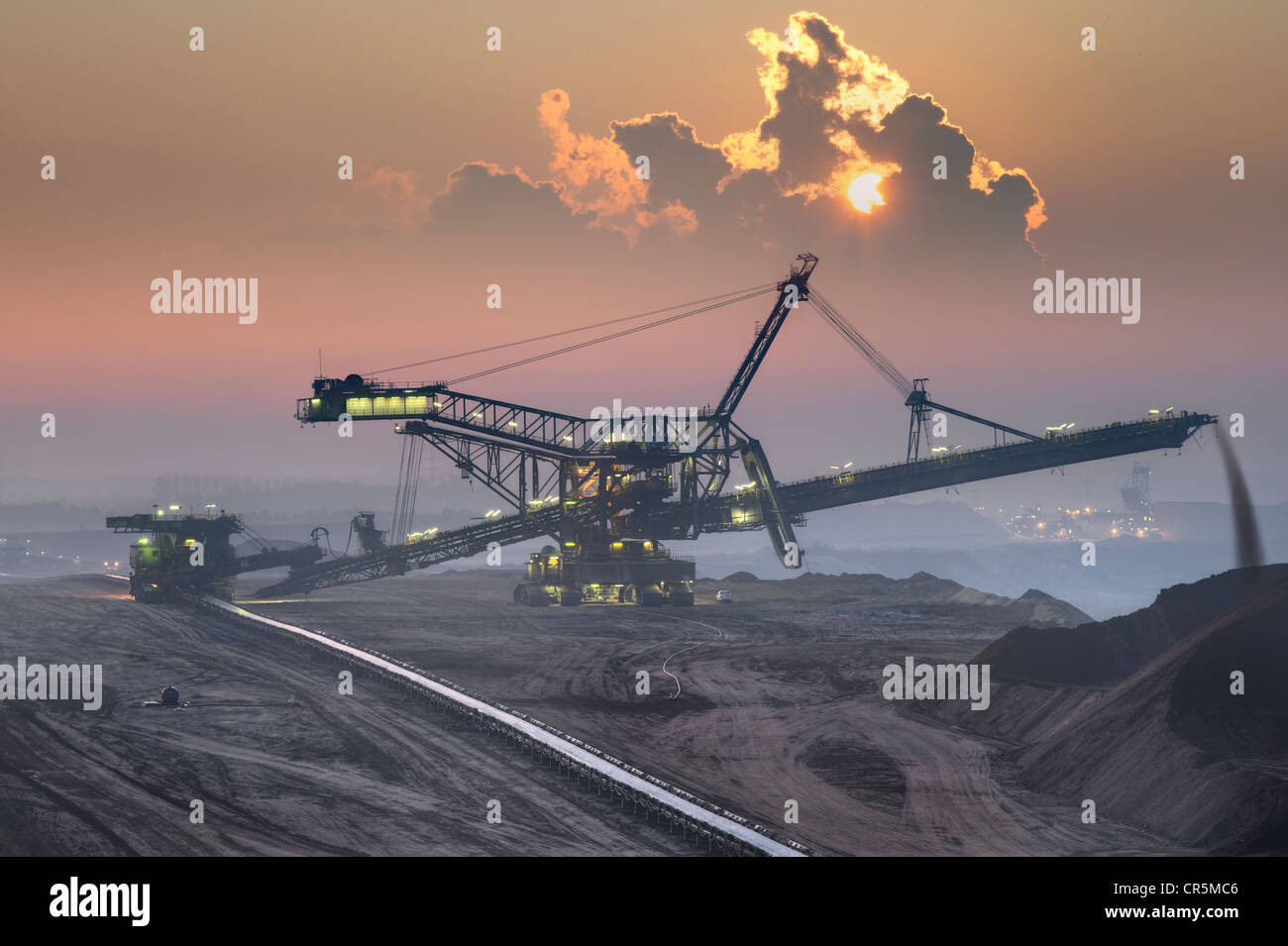 Spreaders in an open-cast lignite mine in the early morning, Garzweiler, North Rhine-Westphalia, Germany, Europe Stock Photo