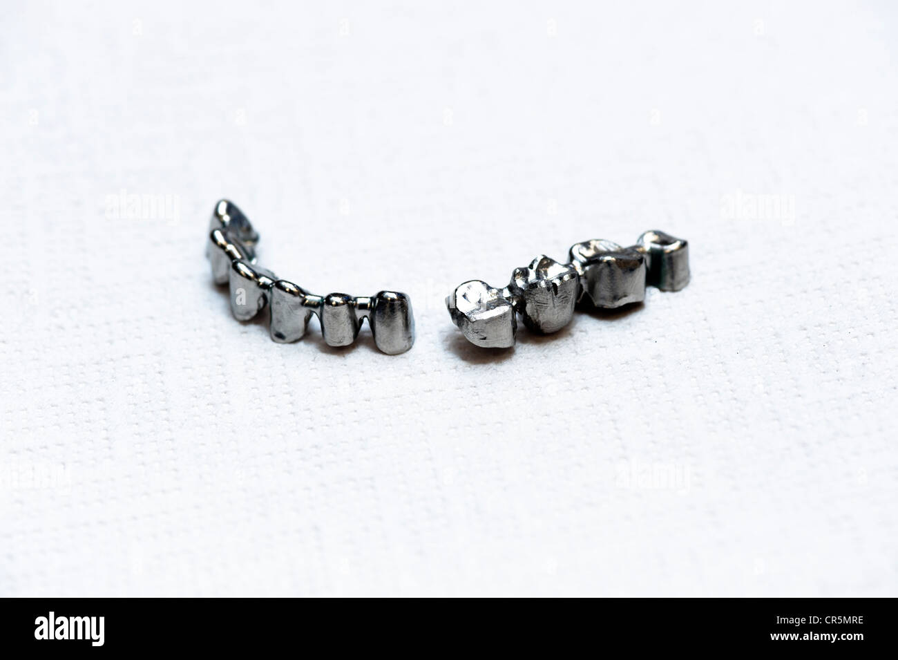 Finished metal framework of tooth crowns Stock Photo Alamy