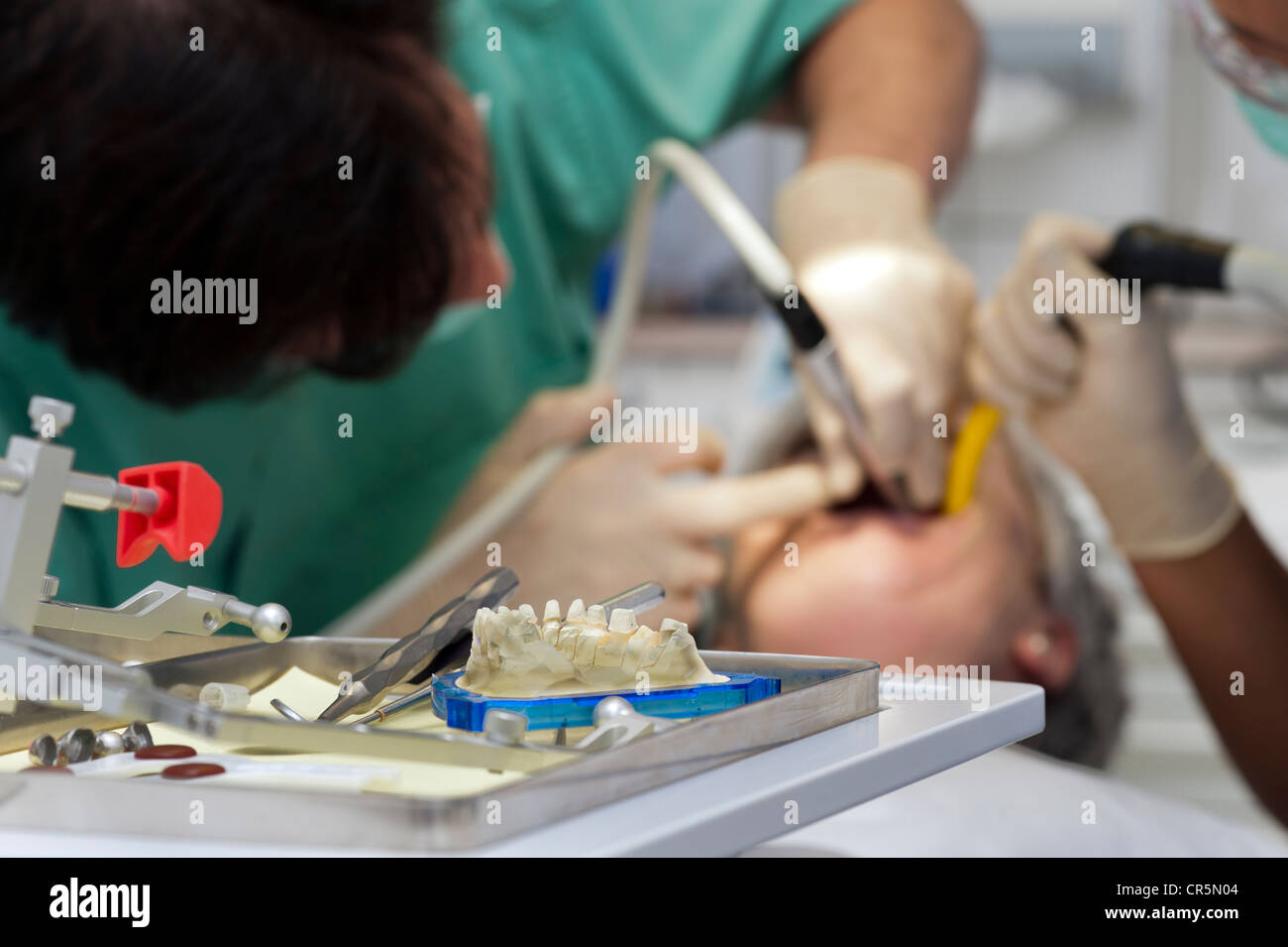 Dentist performing a dental examination Stock Photo