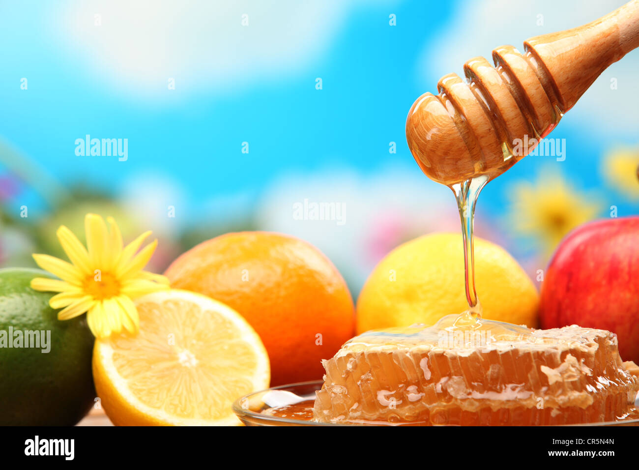 Honey and fresh fruits,closeup. Stock Photo