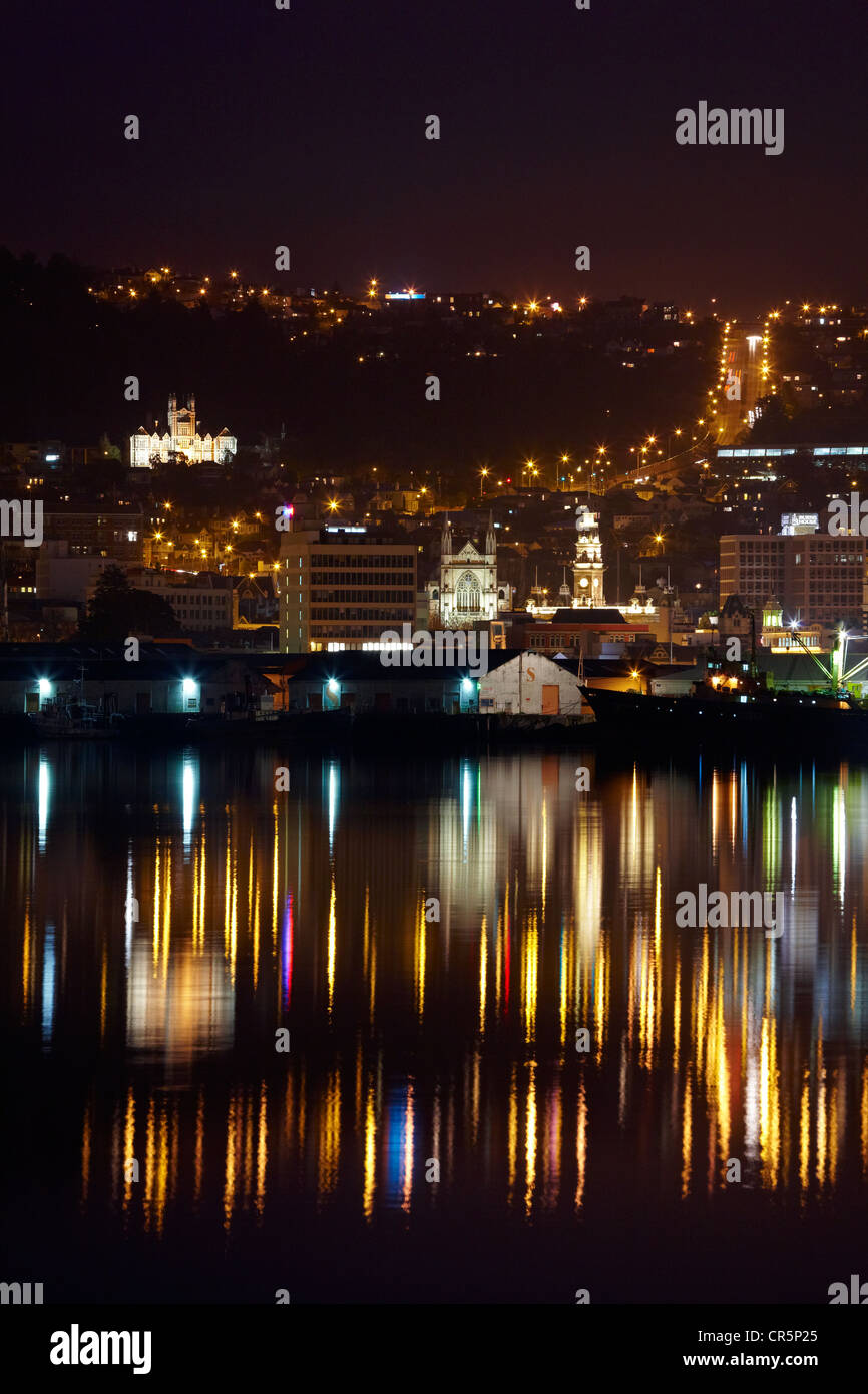 Otago Boys High School, St Pauls Cathedral, Municipal Chambers Clock Tower, and Stuart Street, reflected in Harbour, Dunedin Stock Photo