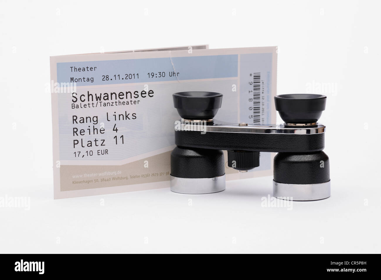 Opera glasses and a ticket for the theatre Stock Photo