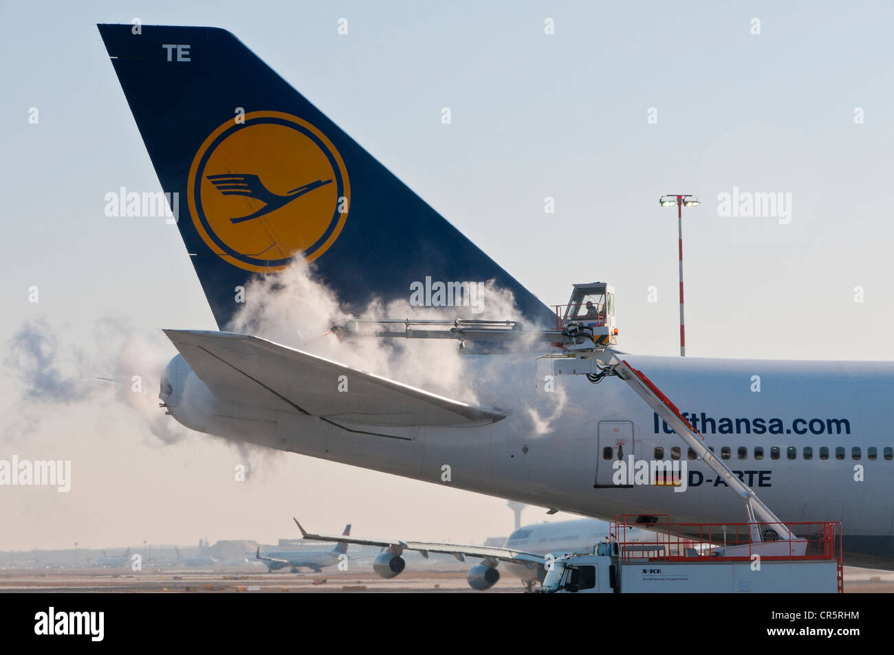 Tail of a Lufthansa Boeing 747-430M being de-iced at Frankfurt Airport, Hesse, Germany, Europe, PublicGround Stock Photo