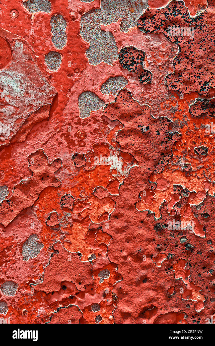 Metal surface with remnants of red paint, texture, background Stock Photo