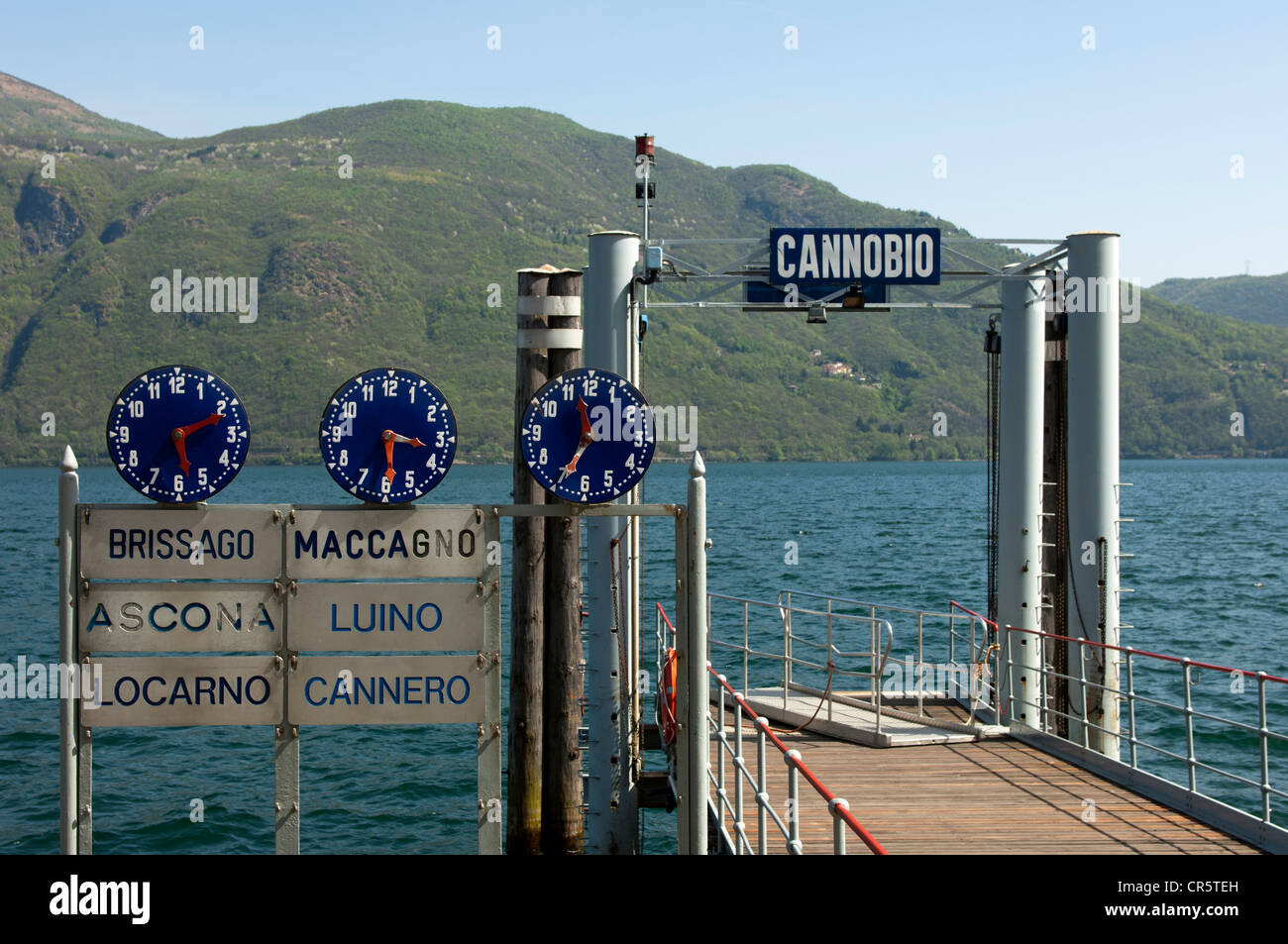 Clocks displaying departure times at the Cannobio jetty on Lake Maggiore, Piedmont, Italy, Europe Stock Photo
